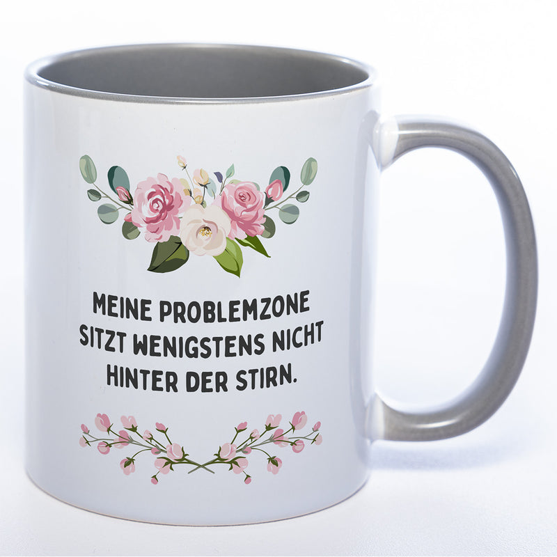 Blümchen-Tasse mit Spruch "Meine Problemzone sitzt wenigstens nicht hinter der Stirn." - Lustige Kaffeetasse spülmaschinenfest